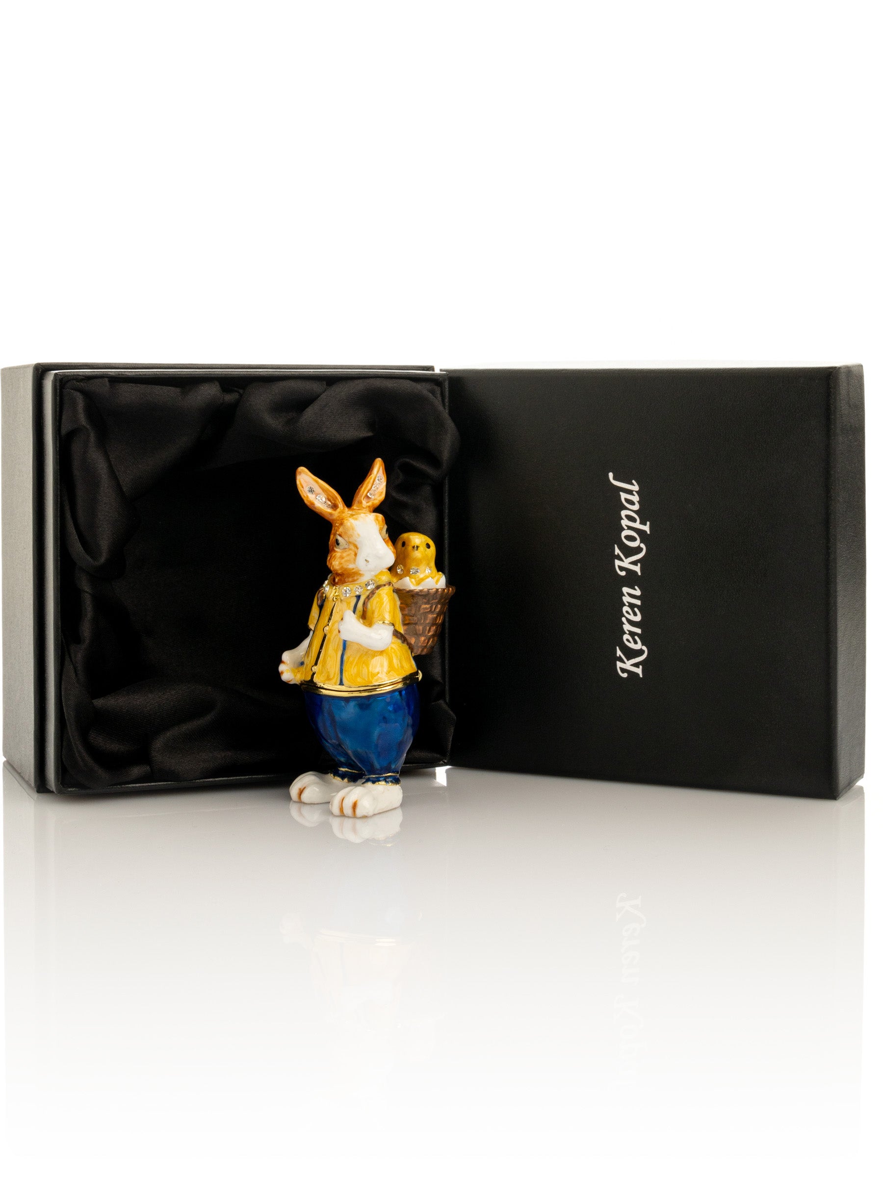 Keren Kopal Easter bunny carrying a baby chick on a basket