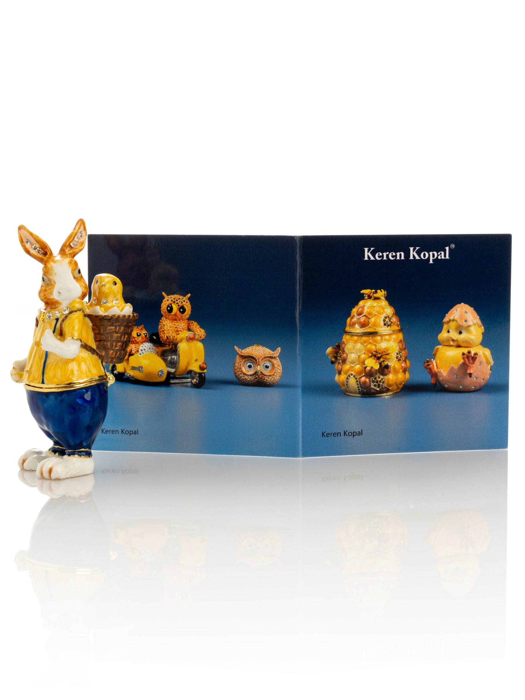 Keren Kopal Easter bunny carrying a baby chick on a basket