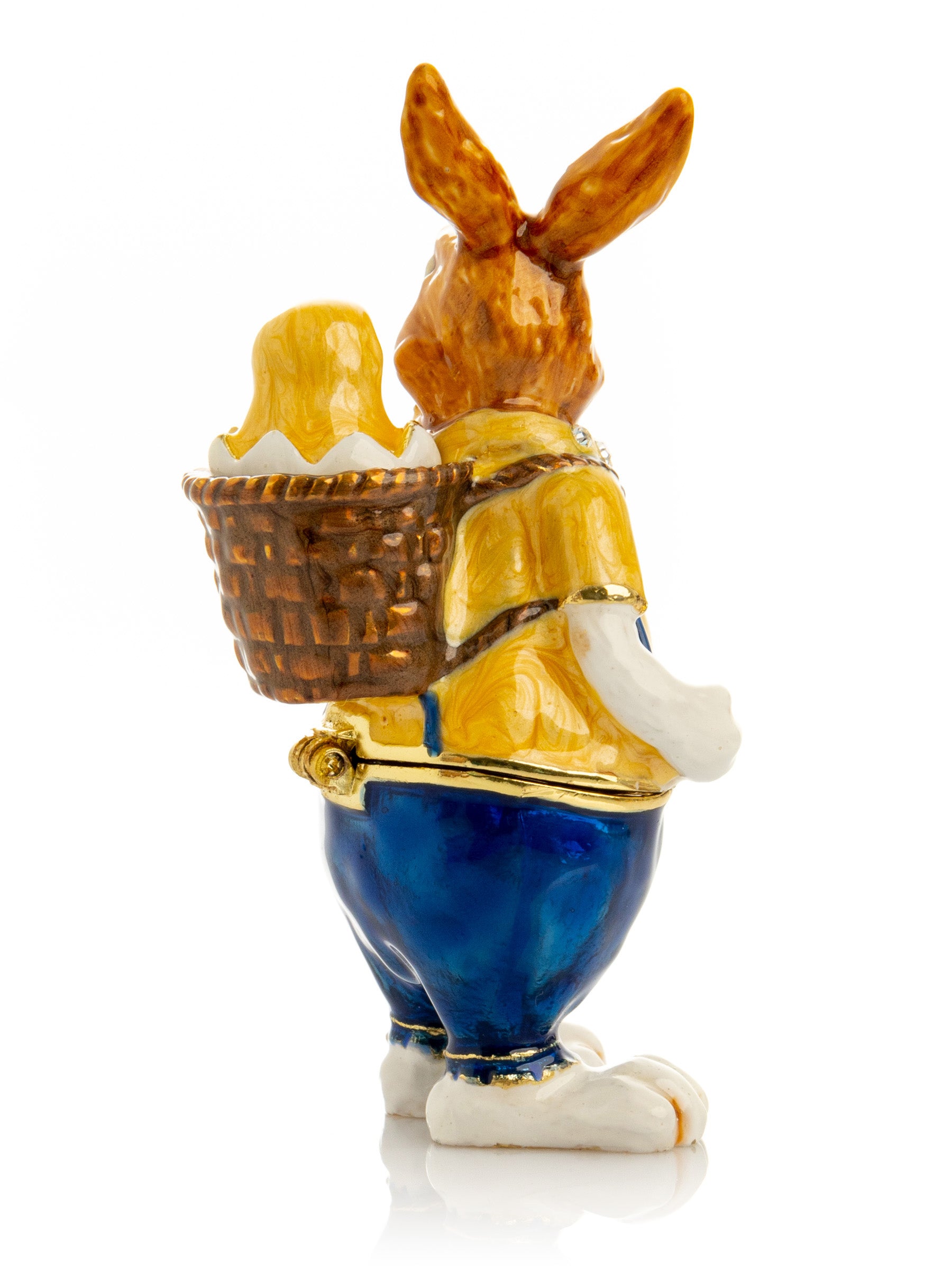 Keren Kopal Easter bunny carrying a baby chick on a basket