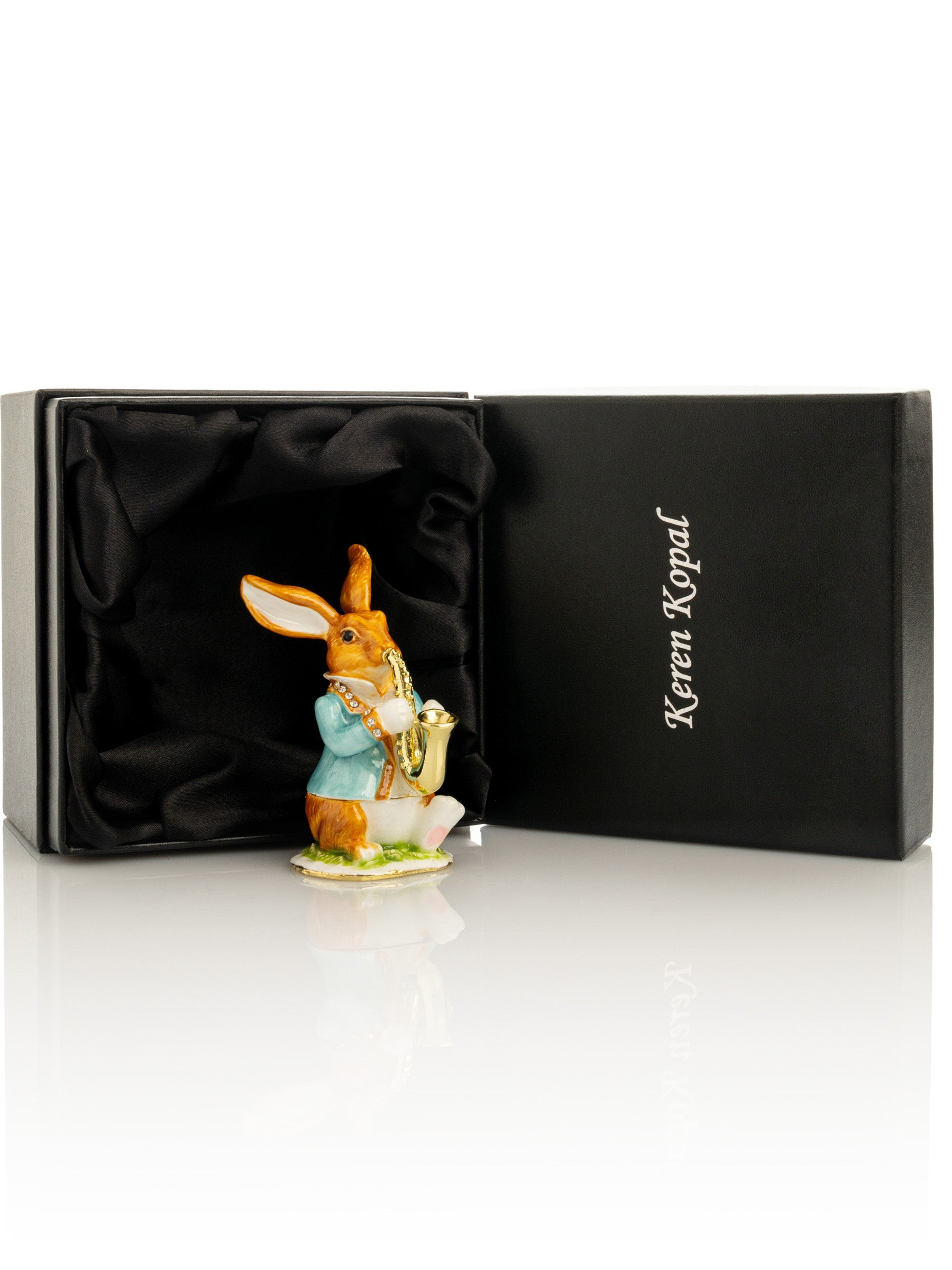 Keren Kopal Easter bunny carrying a baby chick on a basket