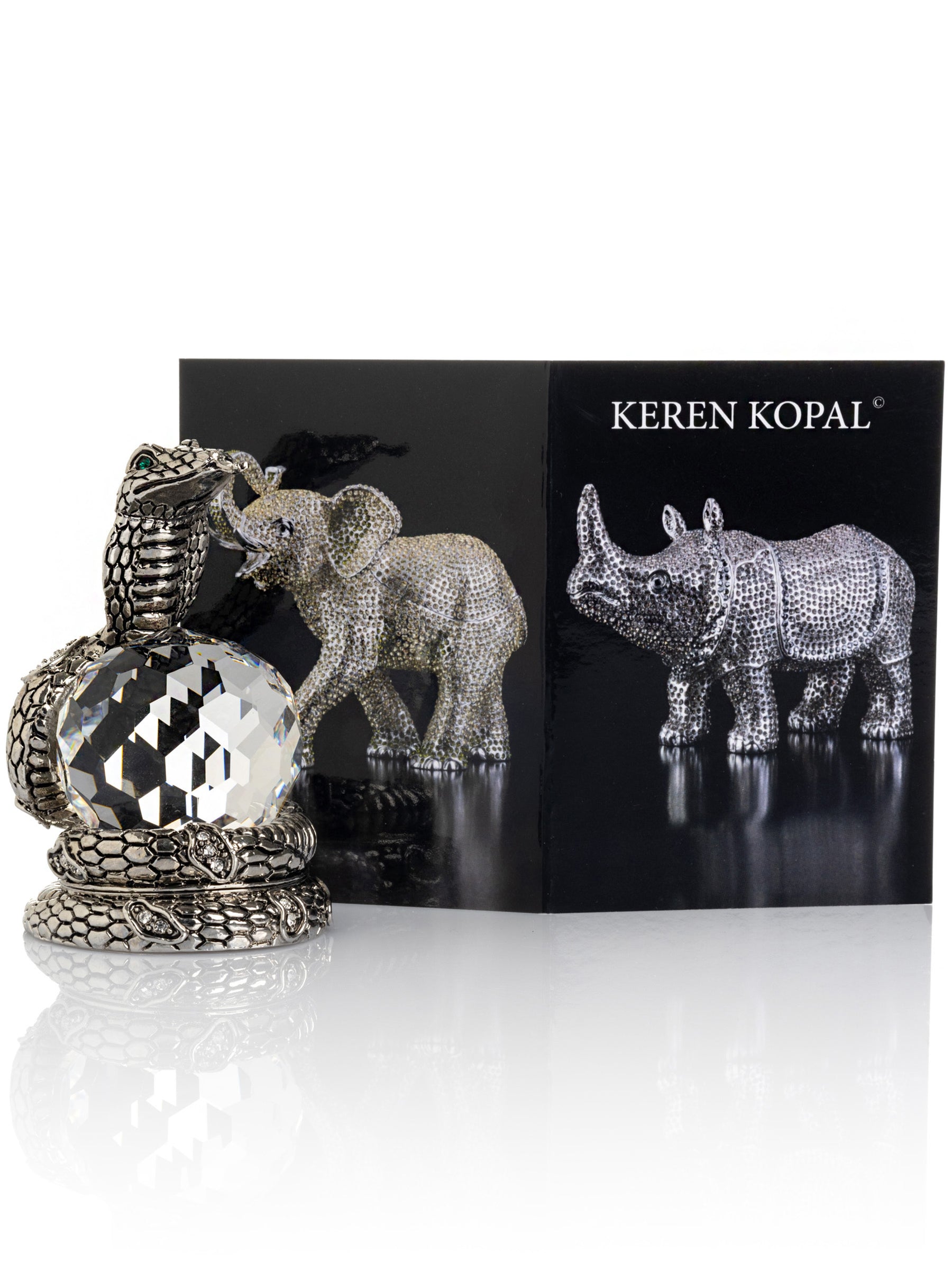 Keren Kopal Snake Holding Crystal