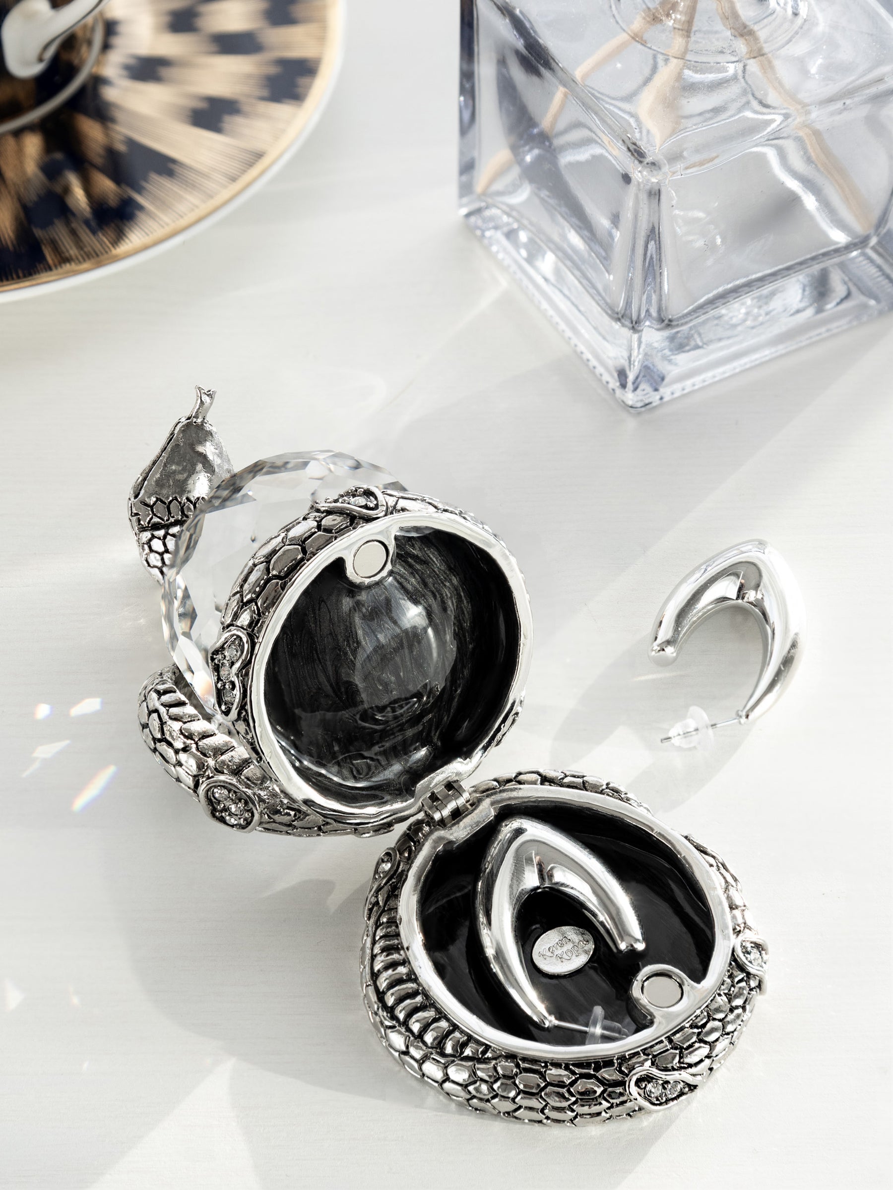 Keren Kopal Snake Holding Crystal