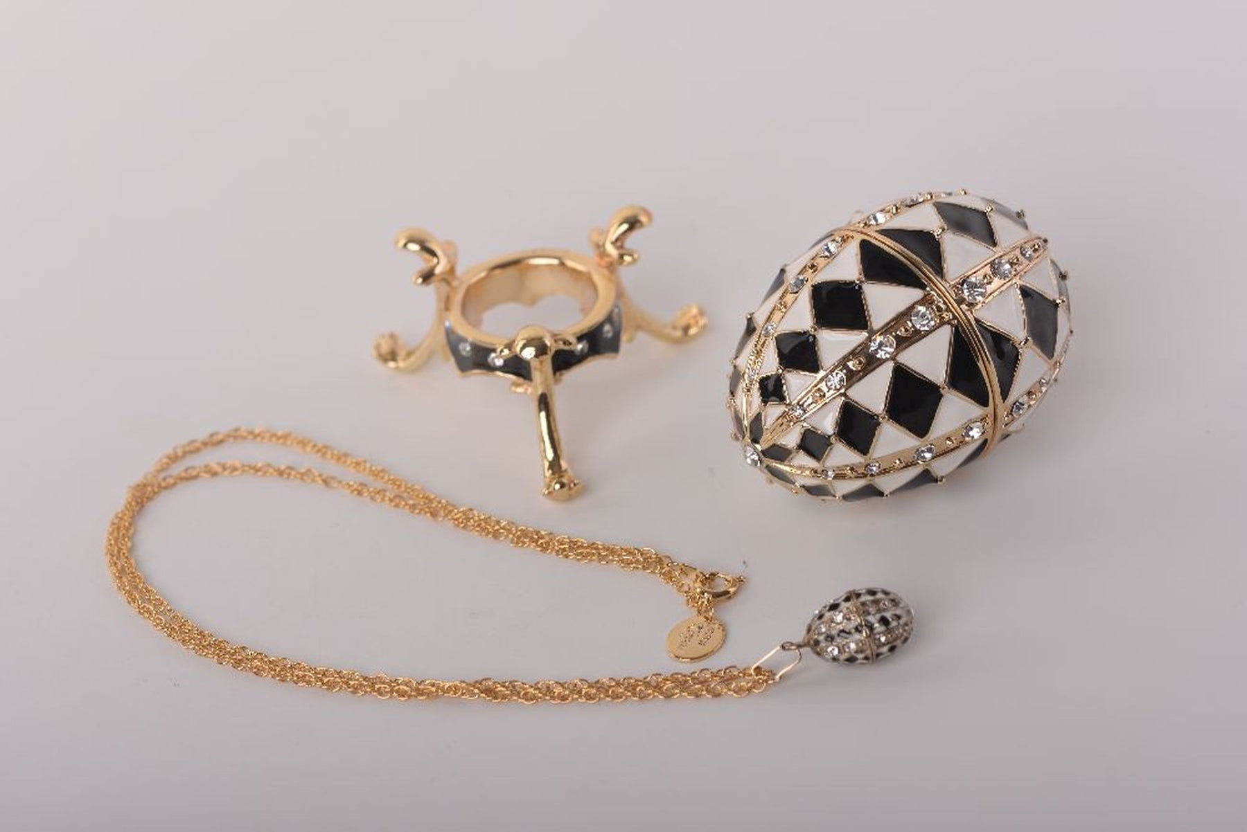 Keren Kopal Black and White Faberge Egg with Gold Necklace Inside
