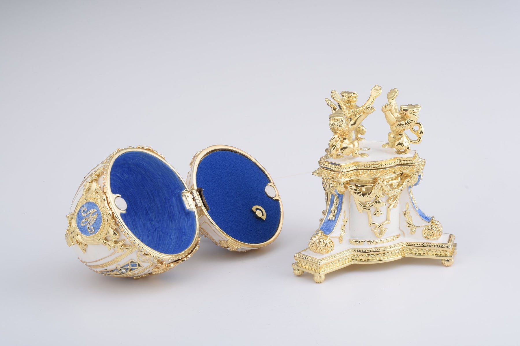 Keren Kopal White Faberge Egg with an Elephant on Top