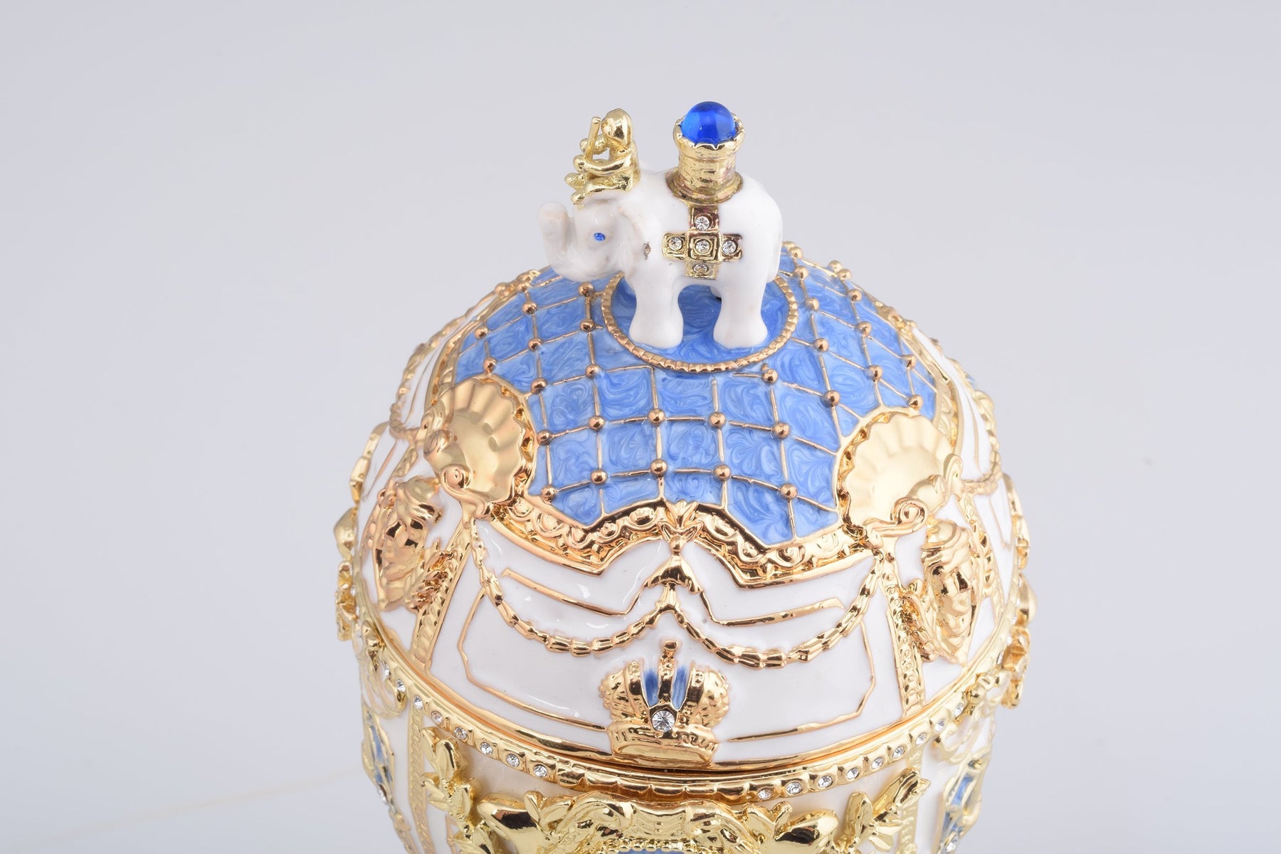 Keren Kopal White Faberge Egg with an Elephant on Top