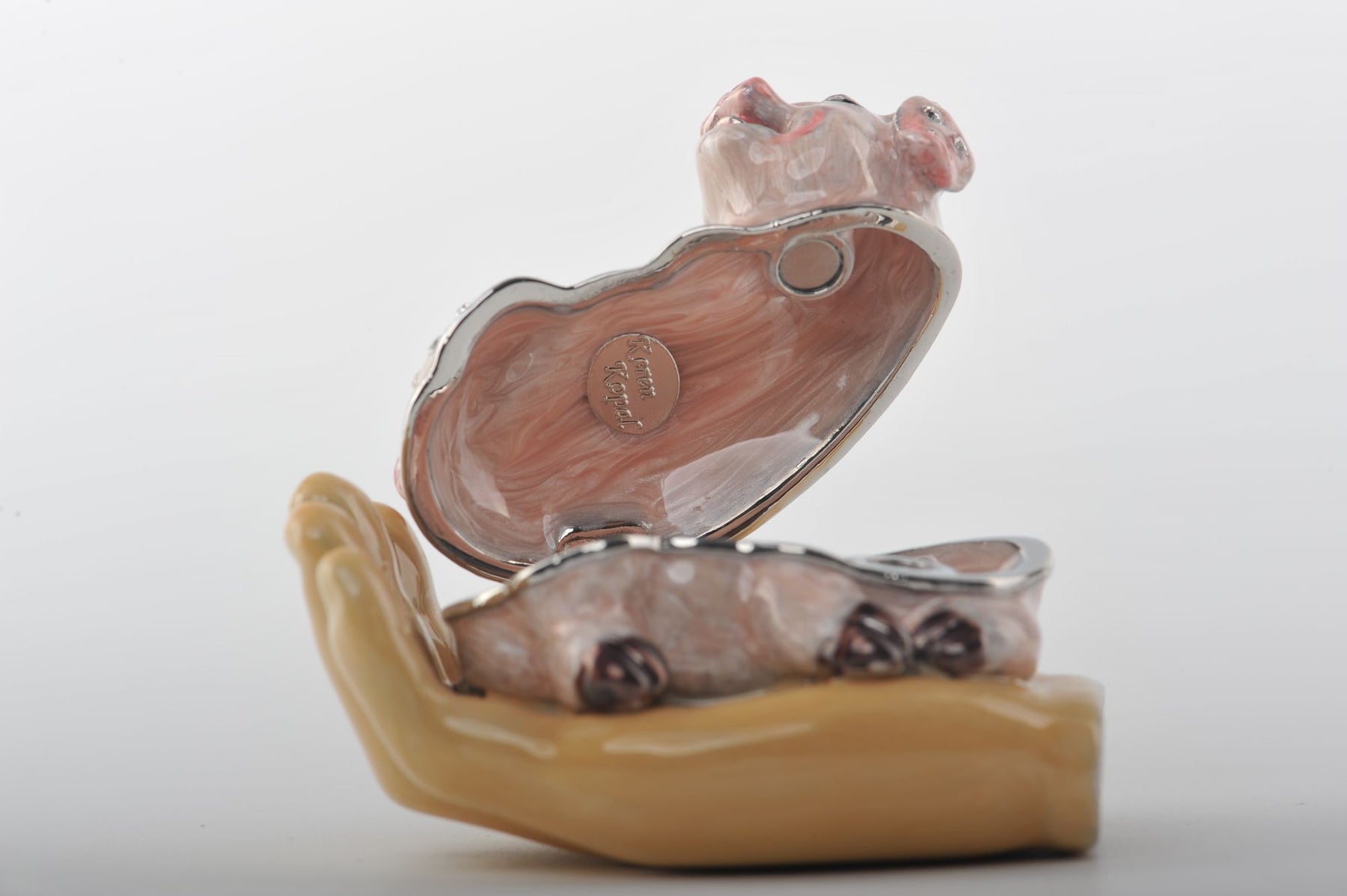 Keren Kopal Zodiac Pig Laying on Hand