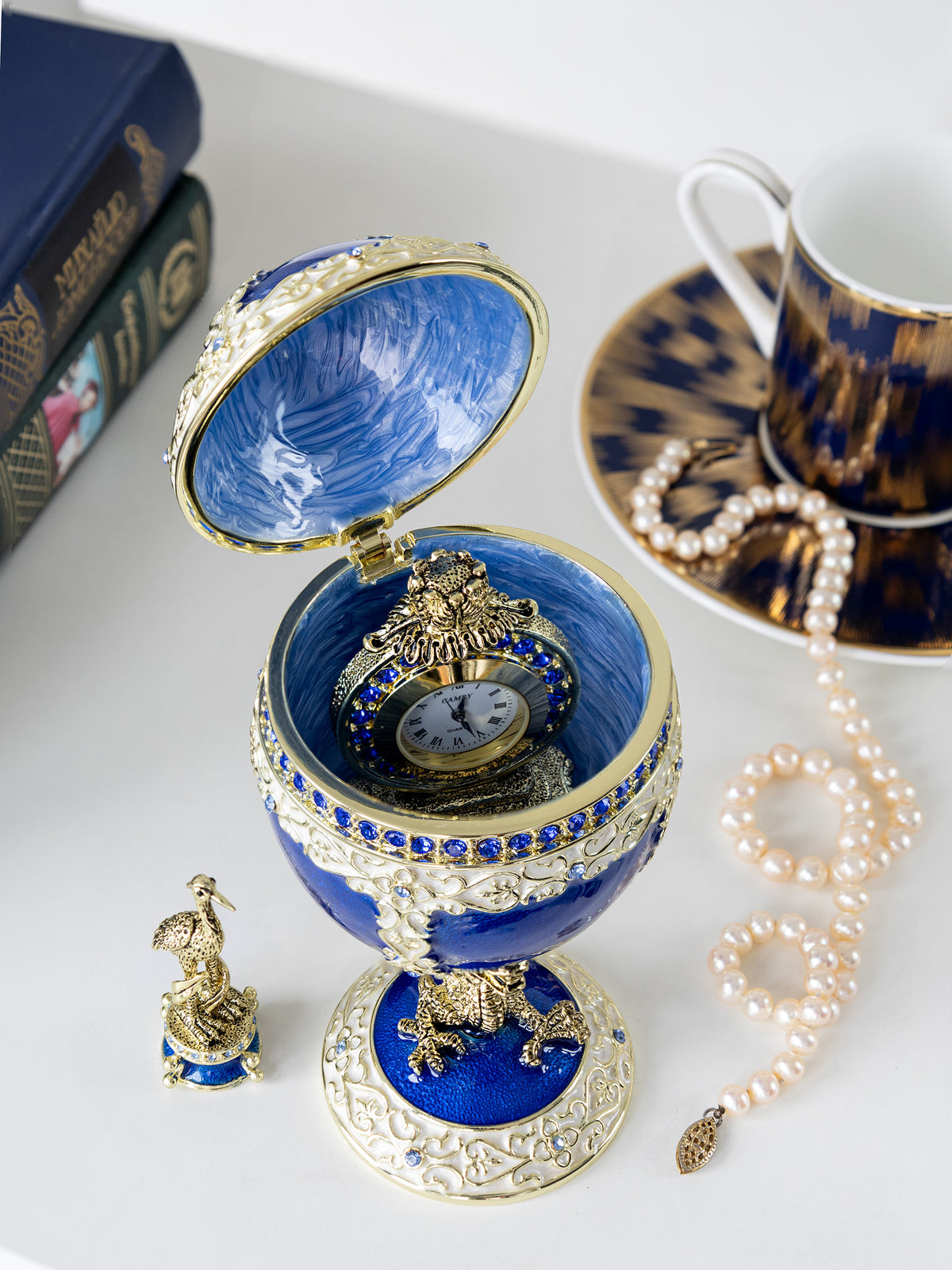 Keren Kopal Luxurious Blue-Gold Egg with Clock with Dragon Pedestal and Bird Ornament