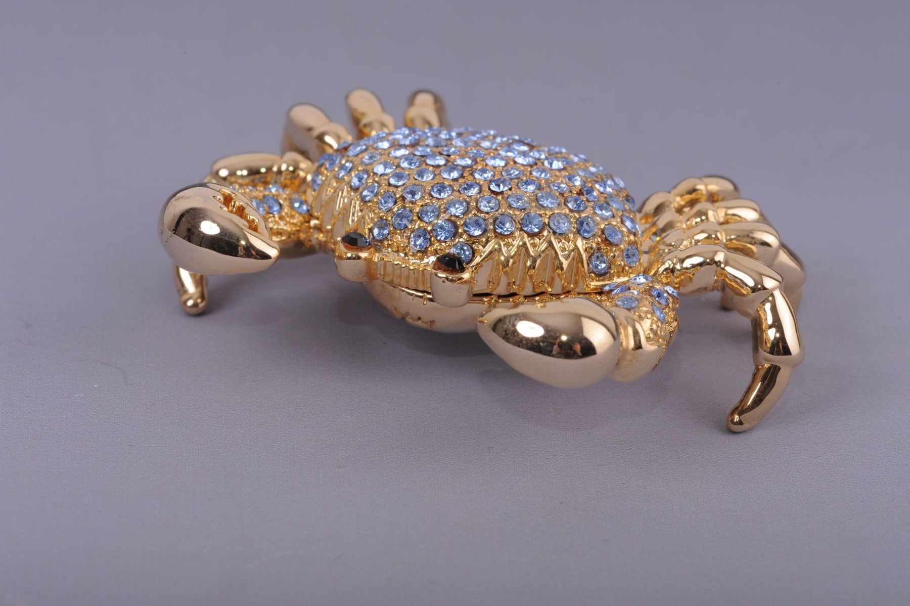 Golden Crab with blue stones