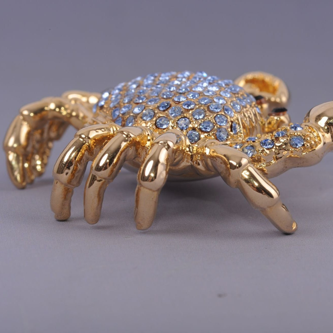 Golden Crab with blue stones