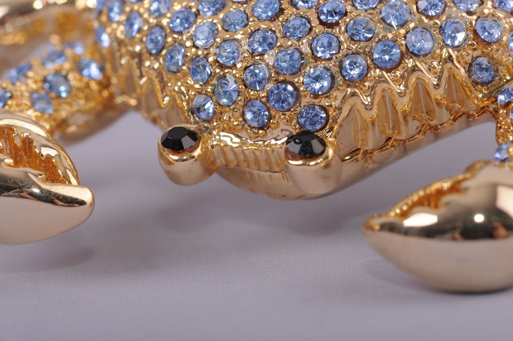 Golden Crab with blue stones