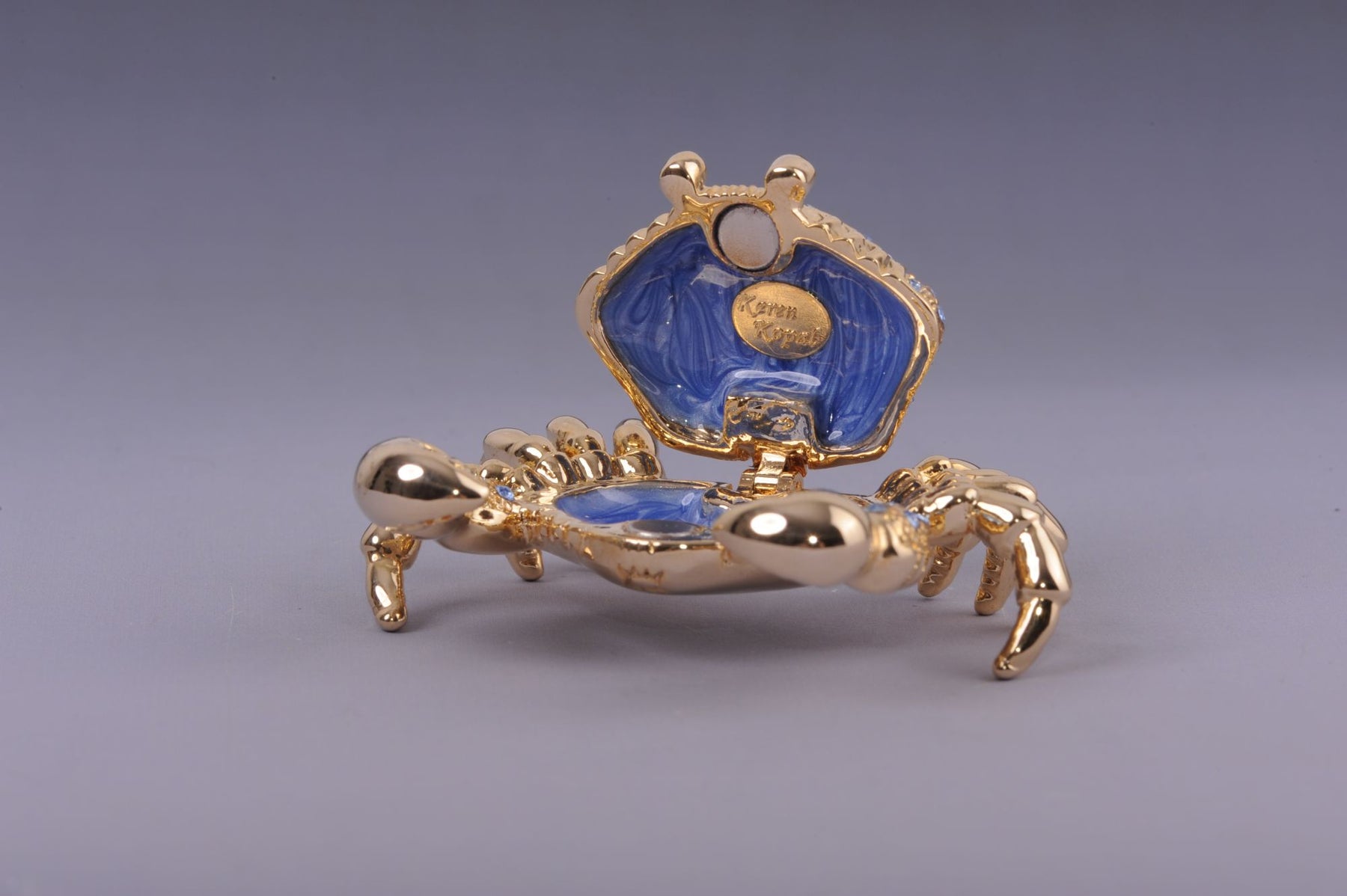 Golden Crab with blue stones