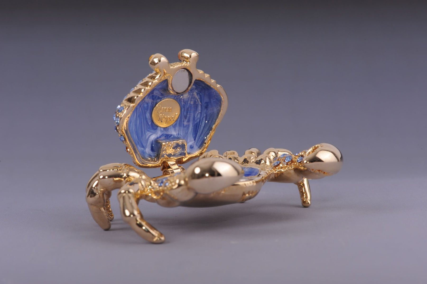 Golden Crab with blue stones