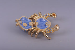 Golden Crab with blue stones