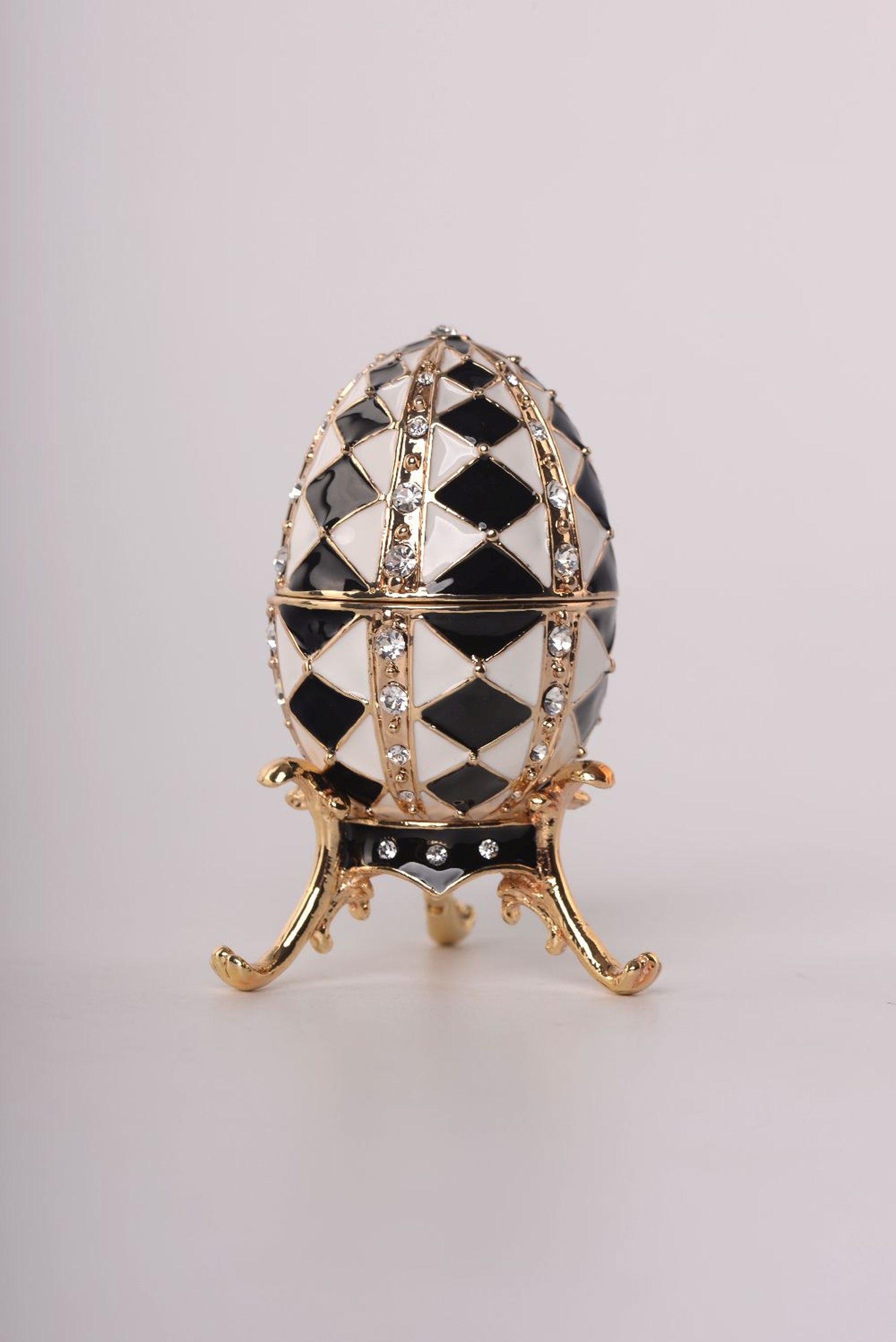 Black and White Faberge Egg with Gold Necklace Inside