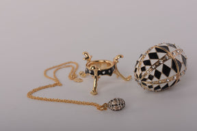 Black and White Faberge Egg with Gold Necklace Inside