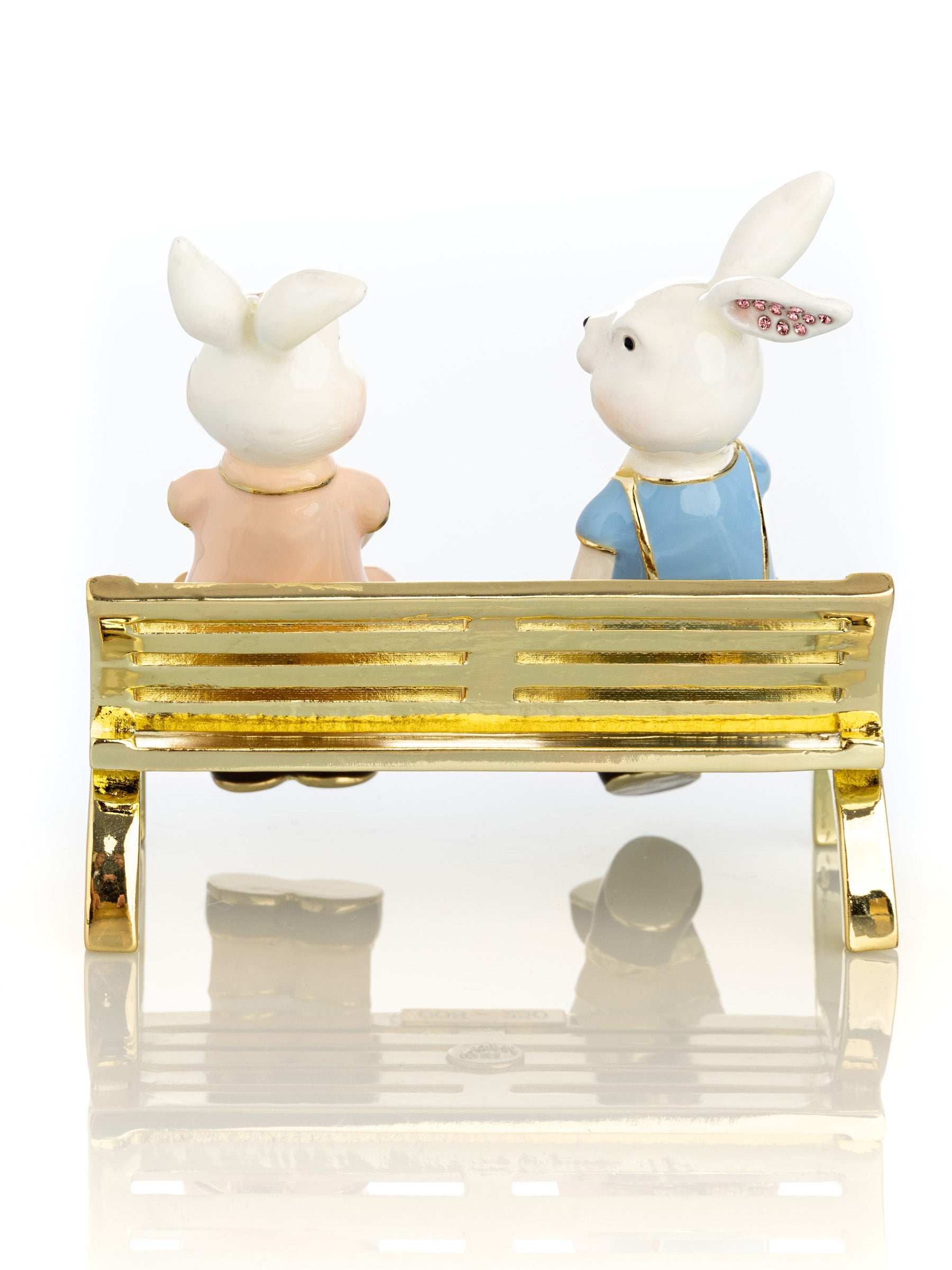 2 bunnies in love sitting on a bench, valentine flowers and chocolates